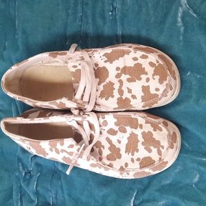 Cow print slip ons